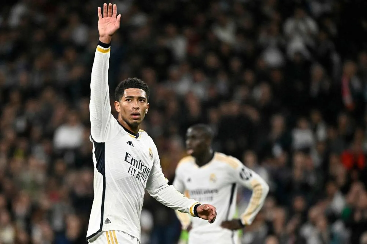 Real Madrid's English midfielder #5 Jude Bellingham waves during the UEFA Champions League last 16 second leg football match between Real Madrid CF and RB Leipzig at the Santiago Bernabeu stadium in Madrid on March 6, 2024. (AFP) 