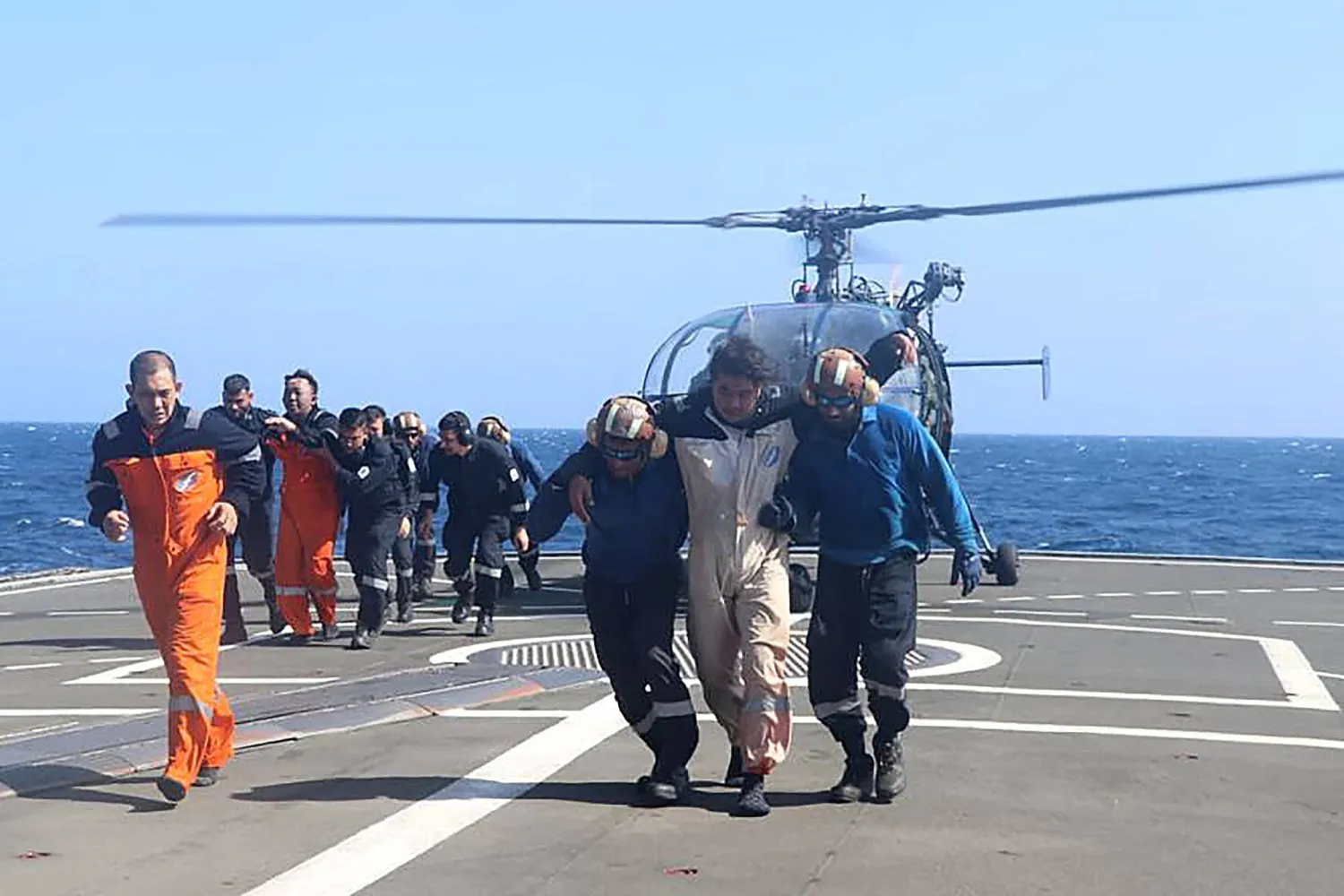 Crew members of the Barbados-flagged bulk carrier M/V True Confidence are rescued by the Indian Navy after a Houthi missile attack, in the Gulf of Aden, off Yemen, Mar. 6, 2024. (AFP/Indian Navy)