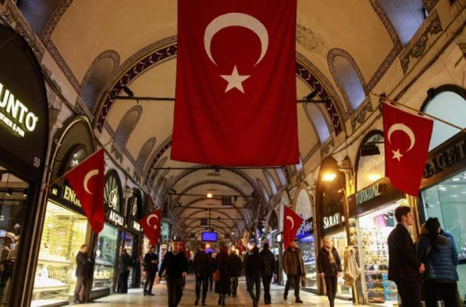 Flags of Türkiye adorn a commercial street in Ankara (Reuters)