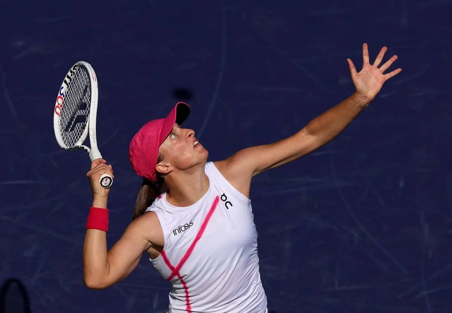 Iga Swiatek of Poland serves against Linda Noskova of the Czech Republic in their third round match during the BNP Paribas Open at Indian Wells Tennis Garden on March 10, 2024 in Indian Wells, California. (Getty Images/AFP)