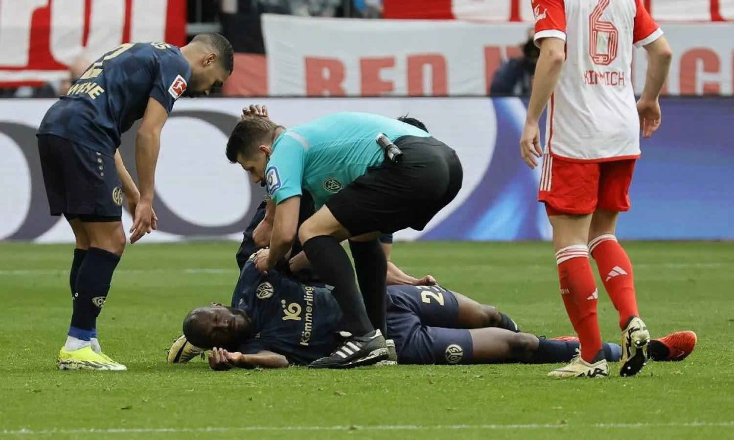 Referee Patrick Ittrich checks on Mainz’s Joshua Guilavogui during the German Bundesliga soccer match between FC Bayern Munich and 1.FSV Mainz 05 in Munich, Germany, 09 March 2024. (EPA)