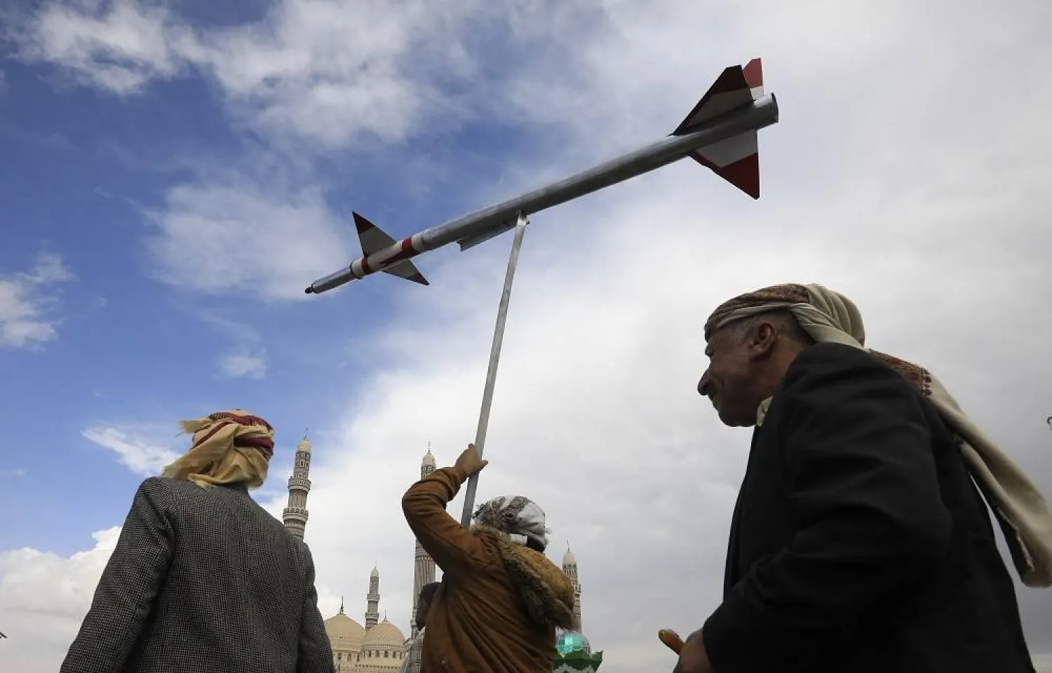 A Houthi supporter holds up a mock missile during a protest against the US and Israel and in support of Palestinians, in Sanaa, Yemen, 08 March 2024. (EPA)
