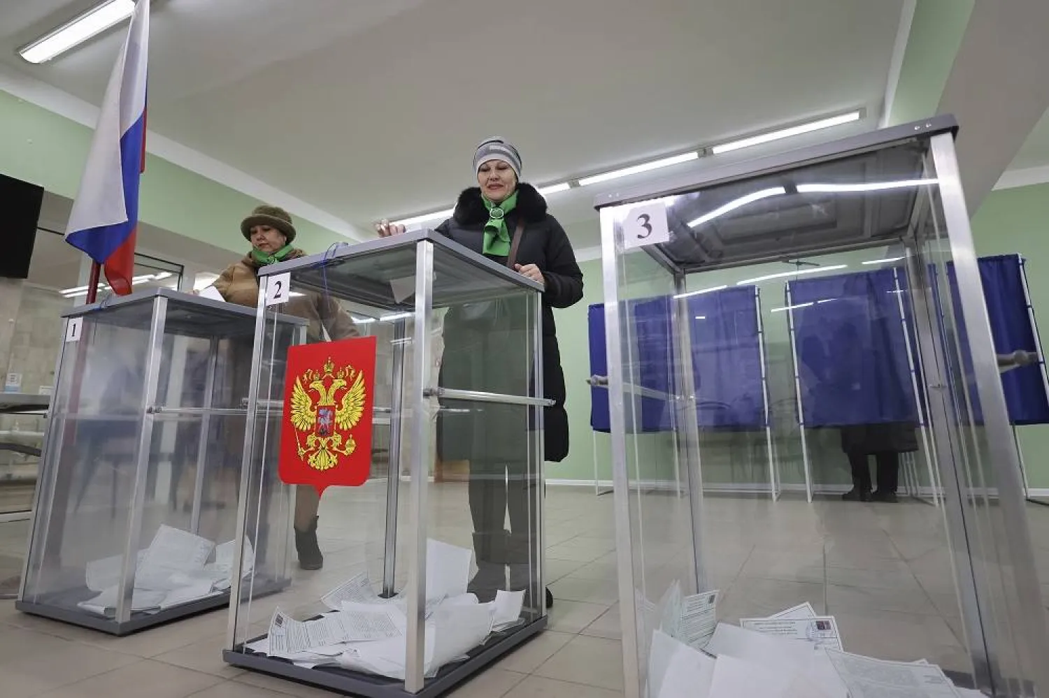 Women vote at a polling station during a presidential election in Makiivka, Russian-controlled Donetsk region, eastern Ukraine, Friday, March 15, 2024. (AP)
