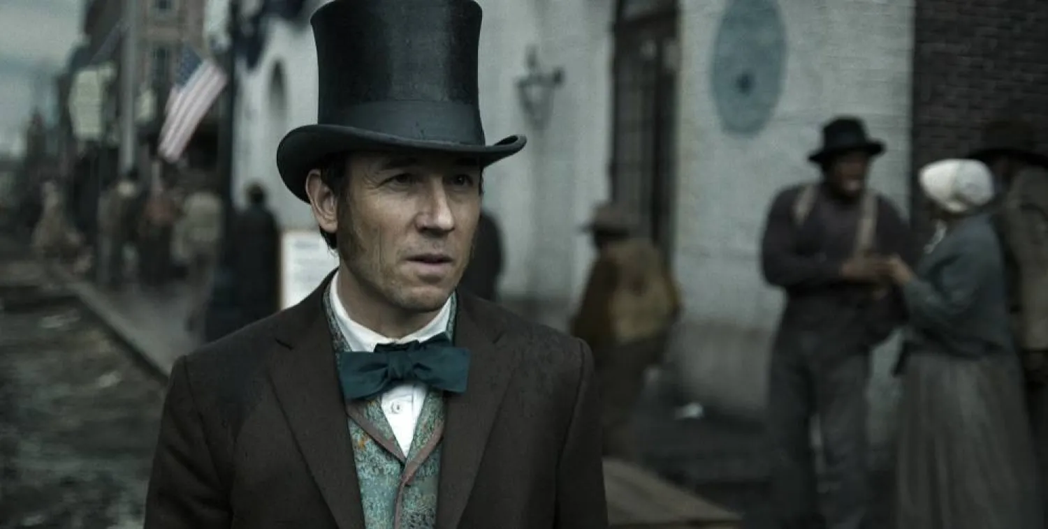 This image released by Apple TV+ shows Tobias Menzies in a scene from "Manhunt." (Apple TV+ via AP)