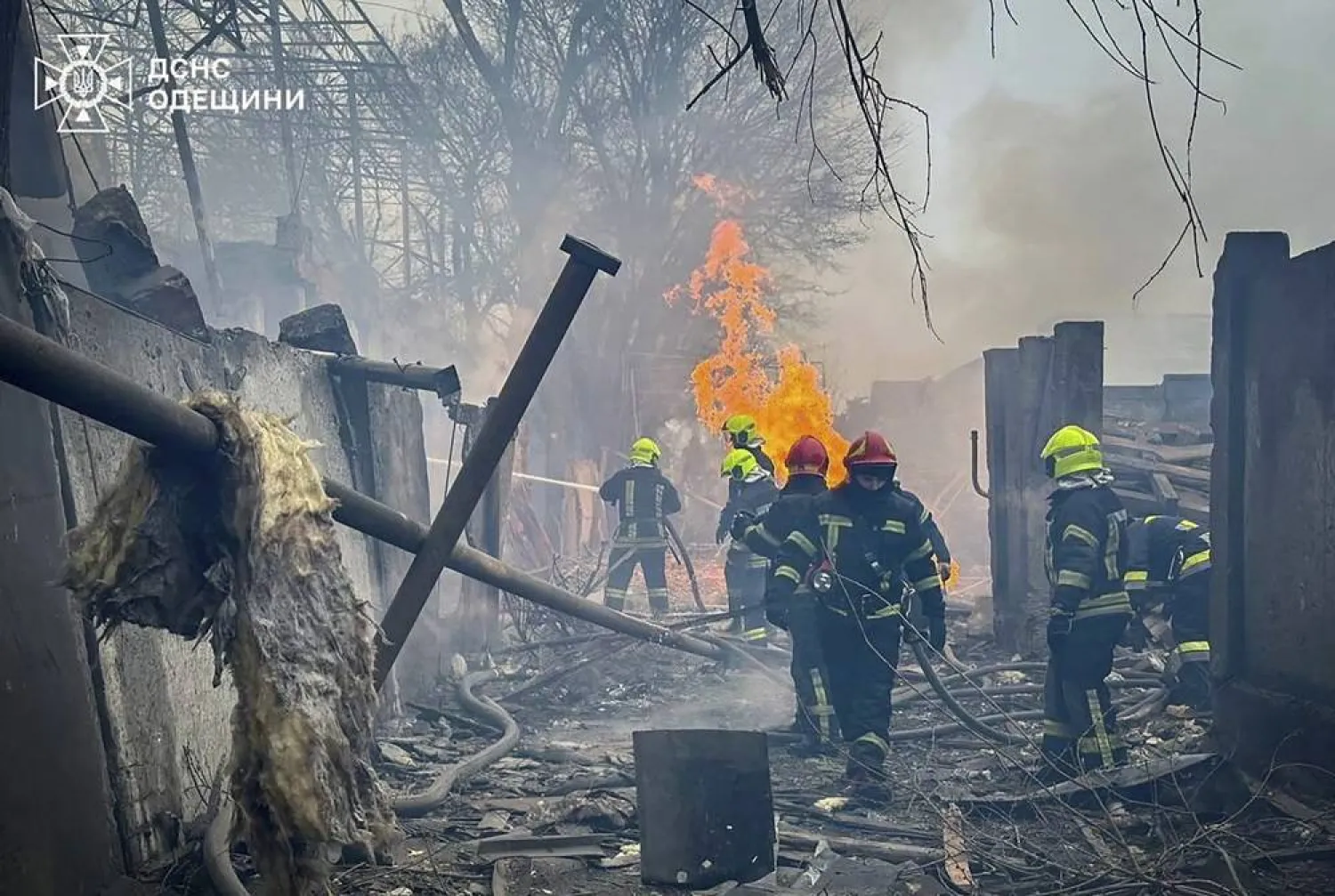 A handout picture made available by the State Emergency Service shows Ukrainian rescuers working on the site of a damaged civilian infrastructure object after a double rocket attack in the southern city of Odesa, Ukraine, 15 March 2024. (EPA/State Emergency Service Handout)