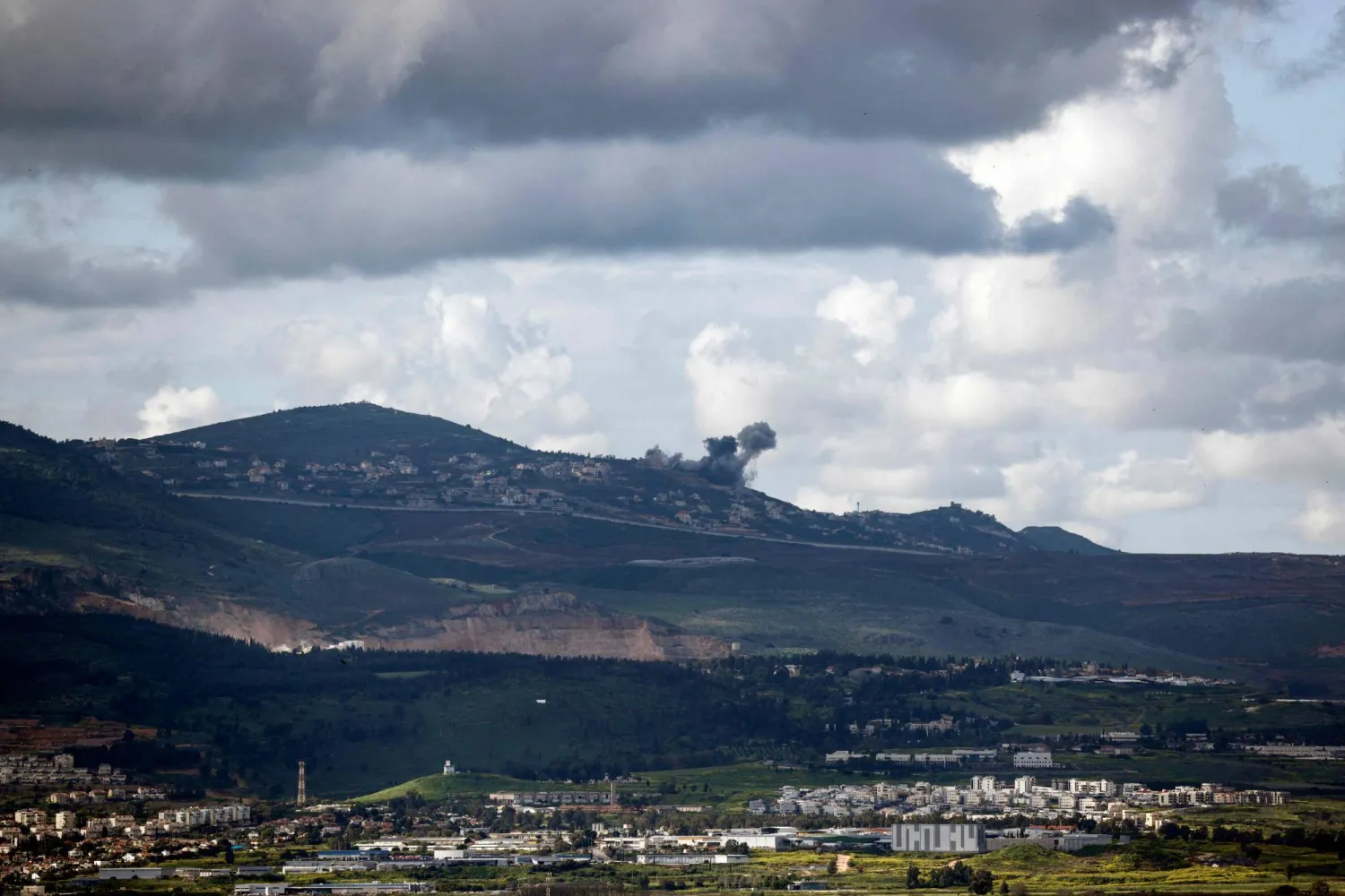 This picture taken from an Israeli position along the border with southern Lebanon shows smoke billowing above the Lebanese village of Kfar Kila during Israeli bombardment on March 15, 2024. (Photo by Jalaa MAREY / AFP)