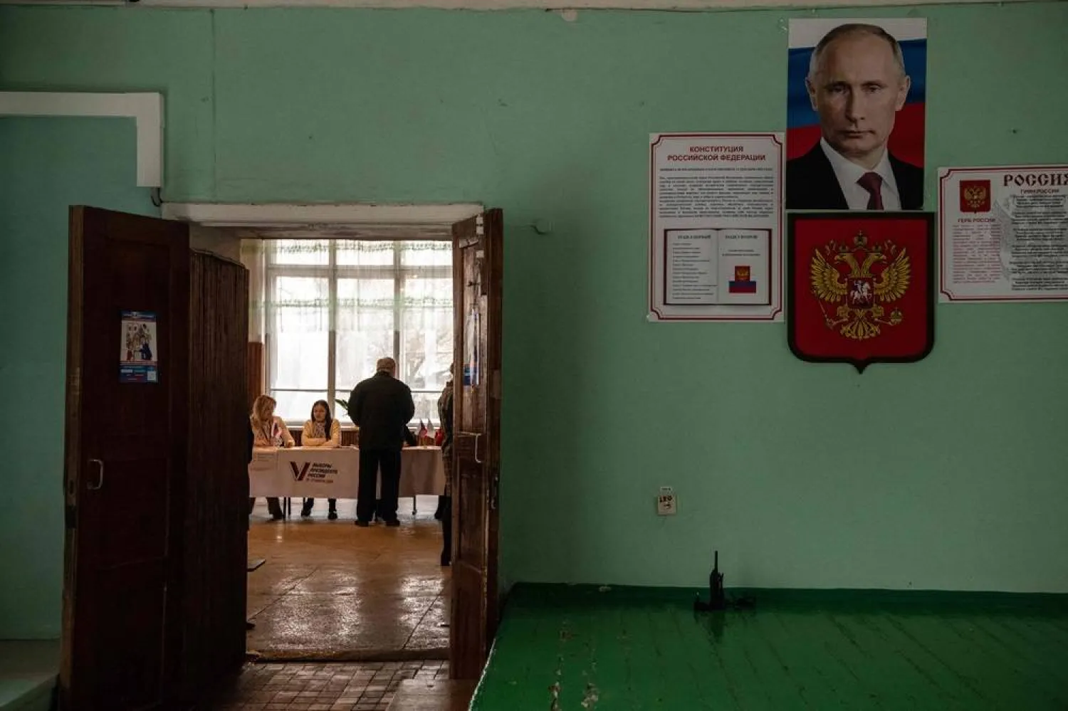 A man registers to vote in Russia's presidential election at a polling station in Donetsk, Russian-controlled Ukraine, amid the Russia-Ukraine conflict on March 16, 2024. (AFP)