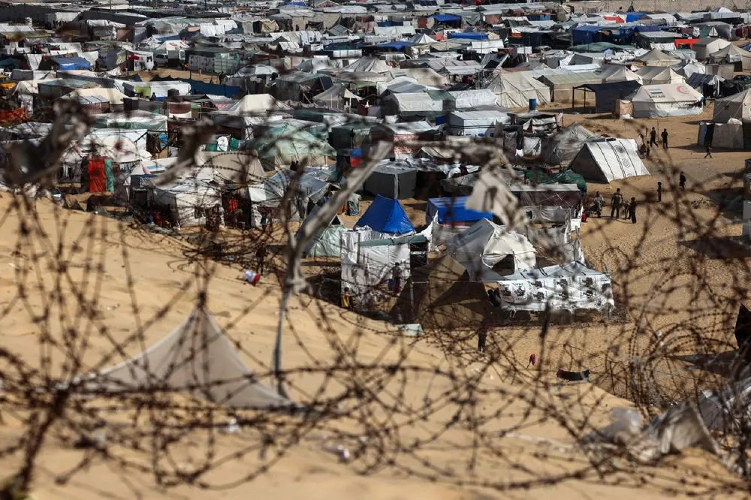  Barbed wire surrounds a camp for displaced people in Rafah in the southern Gaza Strip on March 17, 2024, amid ongoing battles between Israel and Hamas. (AFP) 