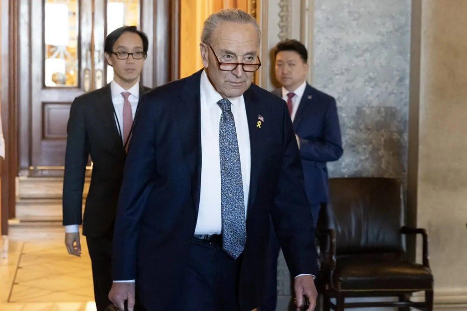 US Senate Majority Leader Chuck Schumer (C) leaves the Senate chamber following a Senate vote on Capitol Hill in Washington, DC, USA, 14 March 2024. (EPA)