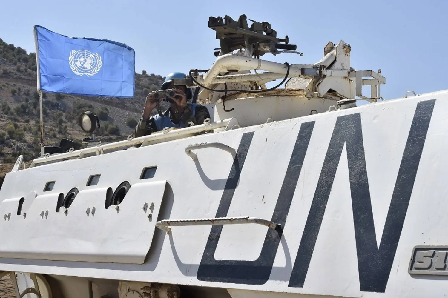 A soldier of the UN peacekeeping mission, United Nations Interim Force in Lebanon (UNIFIL) keeps watch at the Blue Line, the line of withdrawal between Lebanon and Israel, during a visit organized by Hezbollah for Arab youths to the border village of Shebaa, Lebanon, 05 September 2022. (EPA)

