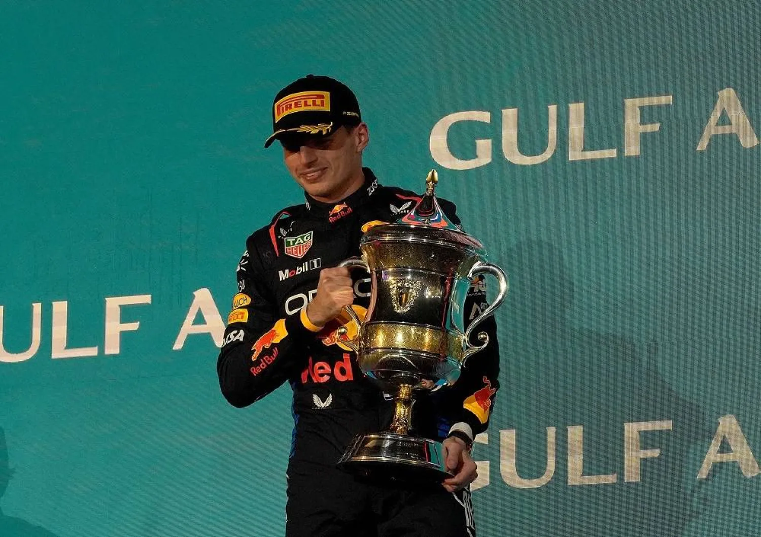 02 March 2024, Bahrain, Sakhir: Dutch Formula 1 driver Max Verstappen of the Oracle Red Bull team celebrates on the podium after winning the Bahrain Grand Prix at the Bahrain International Circuit. (dpa)