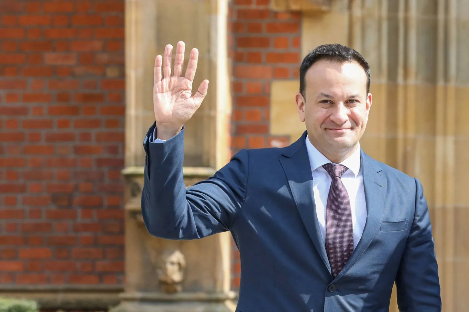 (FILES) Ireland's Prime Minister Leo Varadkar waves as he arrives for the final day of a conference to mark the 25th anniversary of the Good Friday Agreement, at Queen's University in Belfast on April 19, 2023. (Photo by PAUL FAITH / AFP)