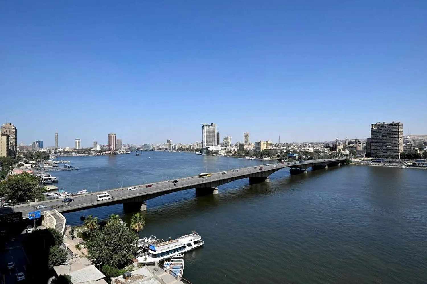 This picture taken on March 20, 2024 shows a view of the Cairo University bridge across the Nile river connecting Cairo (R) with its twin city of Giza (L). (AFP)