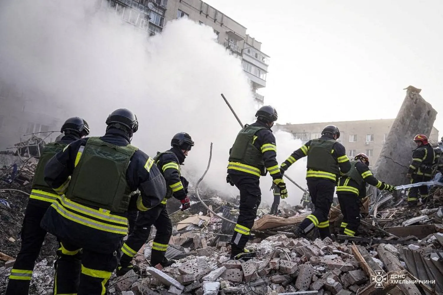 Rescuers work at a site of residential buildings heavily damaged by a Russian missile strike, amid Russia's attack on Ukraine, in Khmelnytskyi, Ukraine March 22, 2024. (Press service of the State Emergency Service of Ukraine in Khmelnytskyi region/Handout via Reuters)