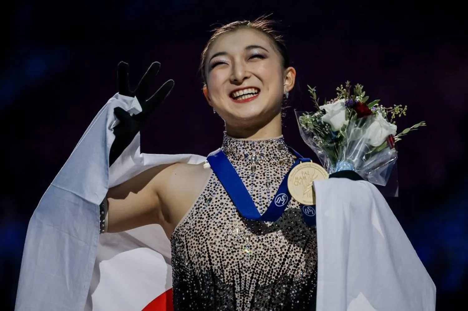 Gold medalist Kaori Sakamoto of Japan reacts after the medals ceremony for the Women's program of the ISU Figure Skating World Championships 2024 in Montreal, Canada, 22 March 2024. (EPA)