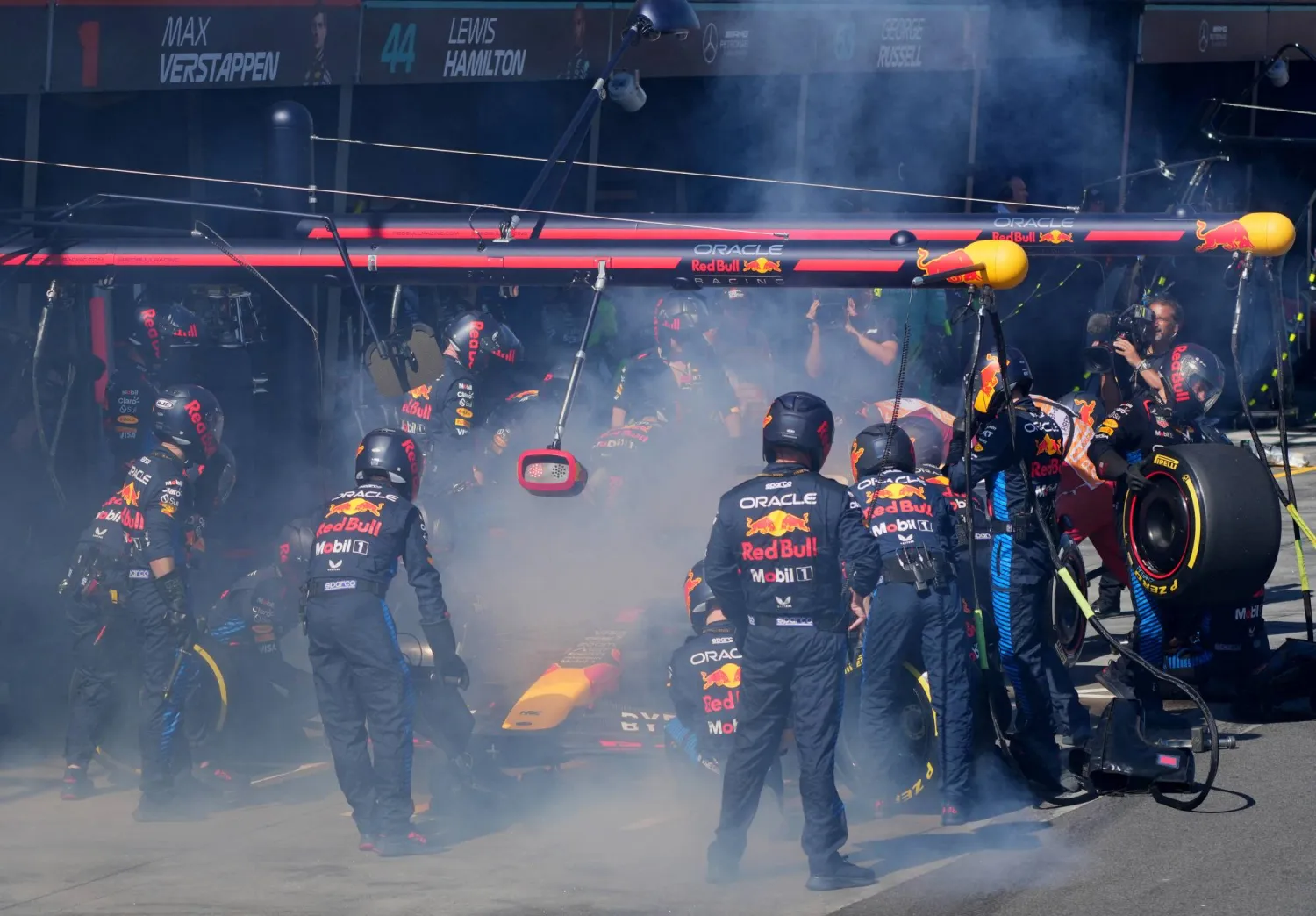 Formula One F1 - Australian Grand Prix - Melbourne Grand Prix Circuit, Melbourne, Australia - March 24, 2024 Red Bull's Max Verstappen returns to the pit stop after retiring from the race due to fire. Pool via REUTERS/Scott Barbour
