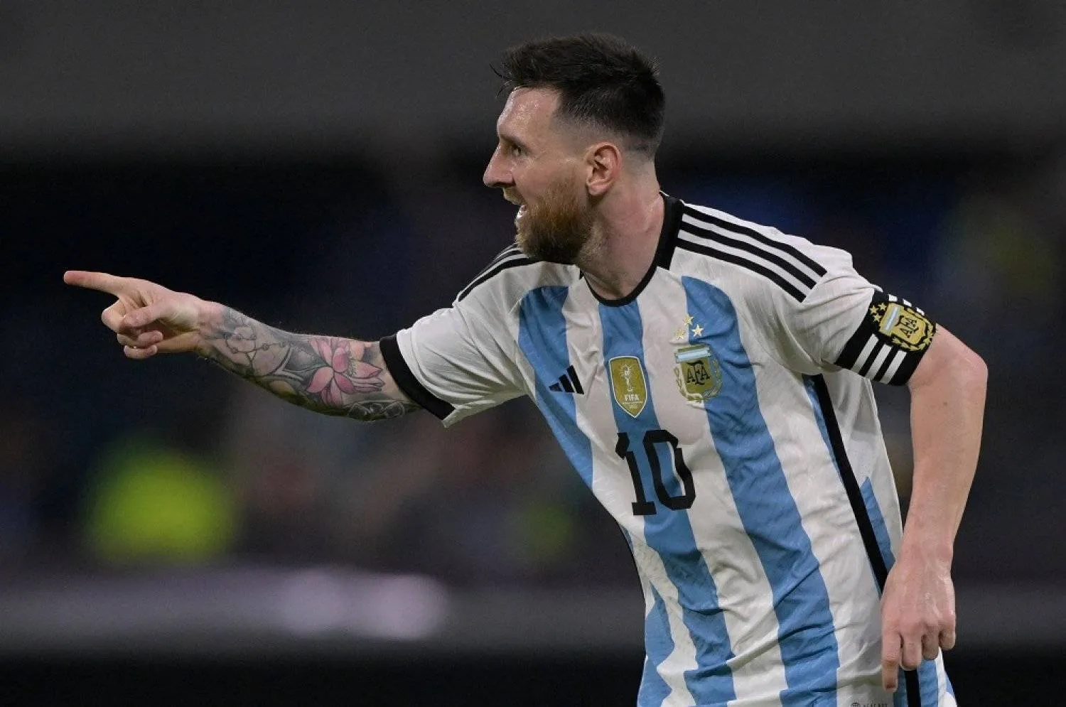 Argentina's forward Lionel Messi celebrates after scoring his team's first goal - his 100th with the national team - during the friendly football match between Argentina and Curacao at the Madre de Ciudades stadium in Santiago del Estero, in northern Argentina, on March 28, 2023. (AFP)
