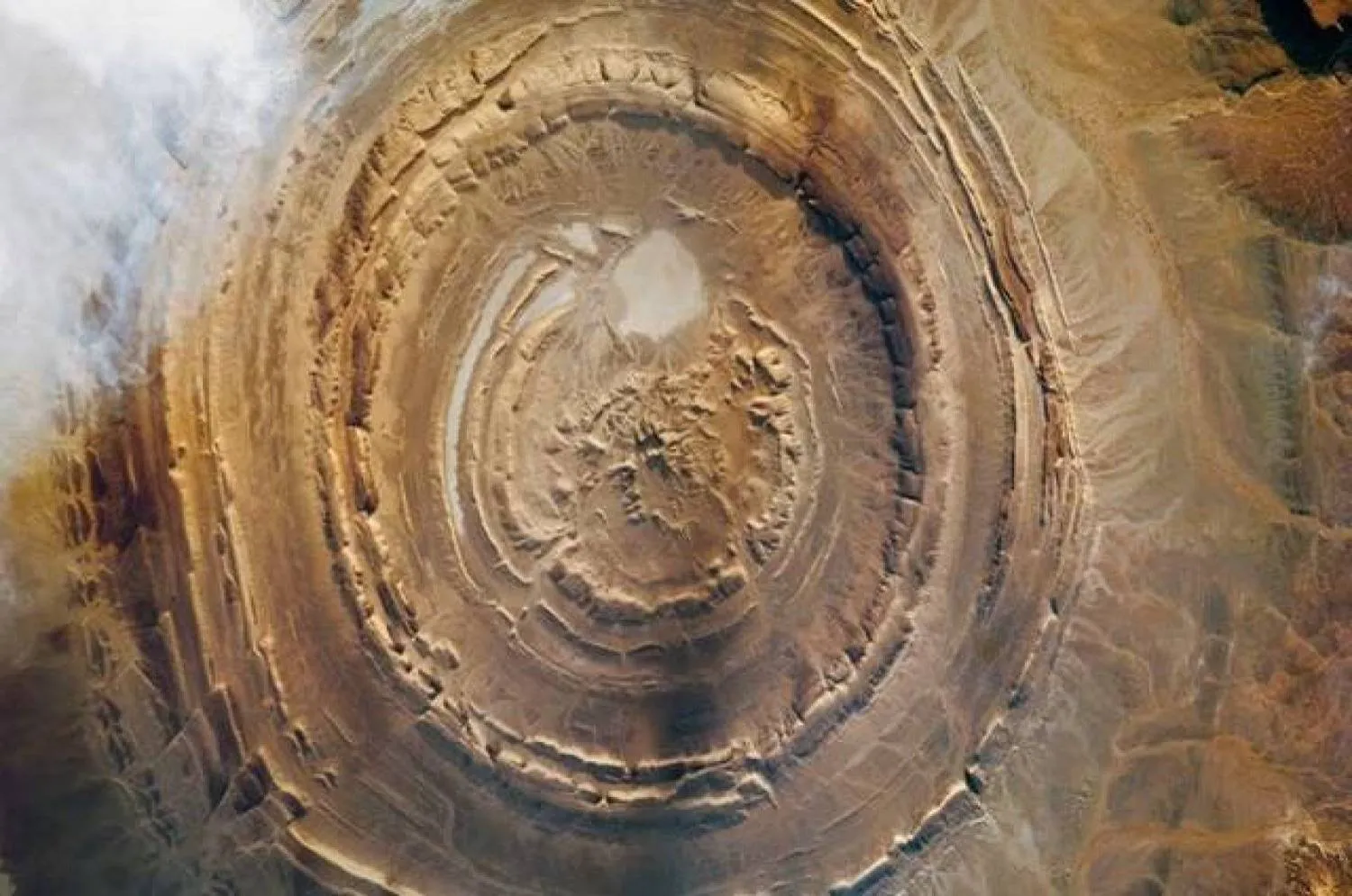 This circular natural feature (the so-called Richat Structure in the Sahara Desert) was once a major prehistoric tool-making and hunting center for Homo erectus ( Nasa)