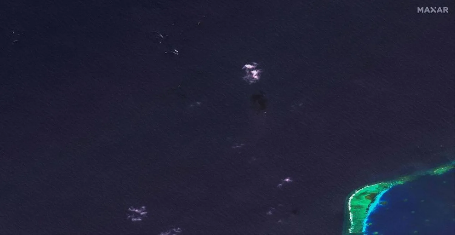 This handout satellite image released by Maxar Technologies on March 24, 2024 and dated March 23, 2024 shows an overview of waters where the Philippines said the China Coast Guard blocked their supply vessel and damaged it with water cannon, during a Philippine supply mission near Second Thomas Shoal in disputed waters of the South China Sea. (Handout / Satellite image 2024 Maxar Technologies / AFP)