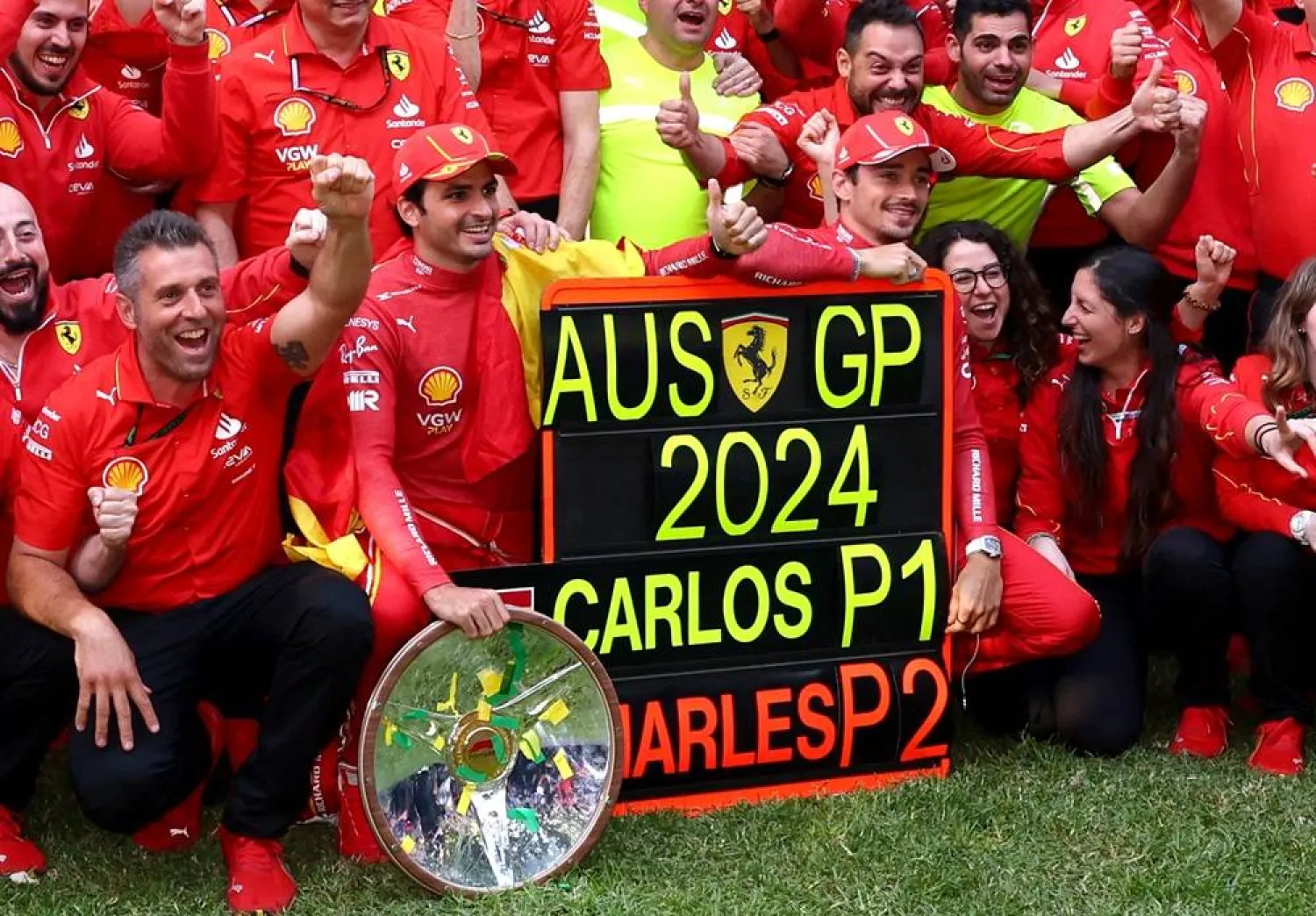 Formula One F1 - Australian Grand Prix - Melbourne Grand Prix Circuit, Melbourne, Australia - March 24, 2024 Ferrari's Carlos Sainz Jr. celebrates with his team after winning the Australian Grand Prix along with second placed Ferrari's Charles Leclerc. (Reuters)
