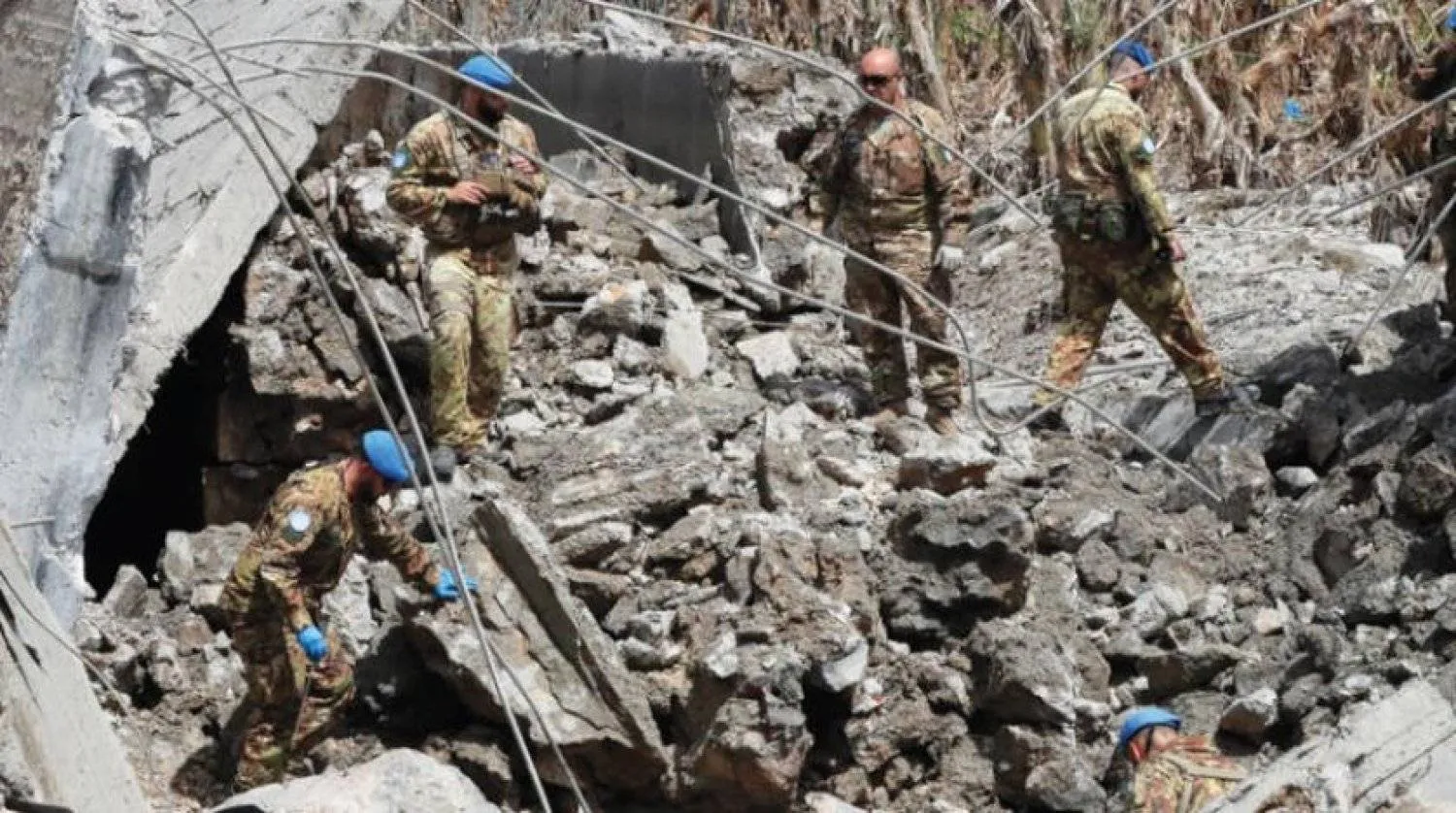 UNIFIL members inspect a farm destroyed by Israeli shelling after rockets were fired from southern Lebanon on April 7, 2023. (AP)
