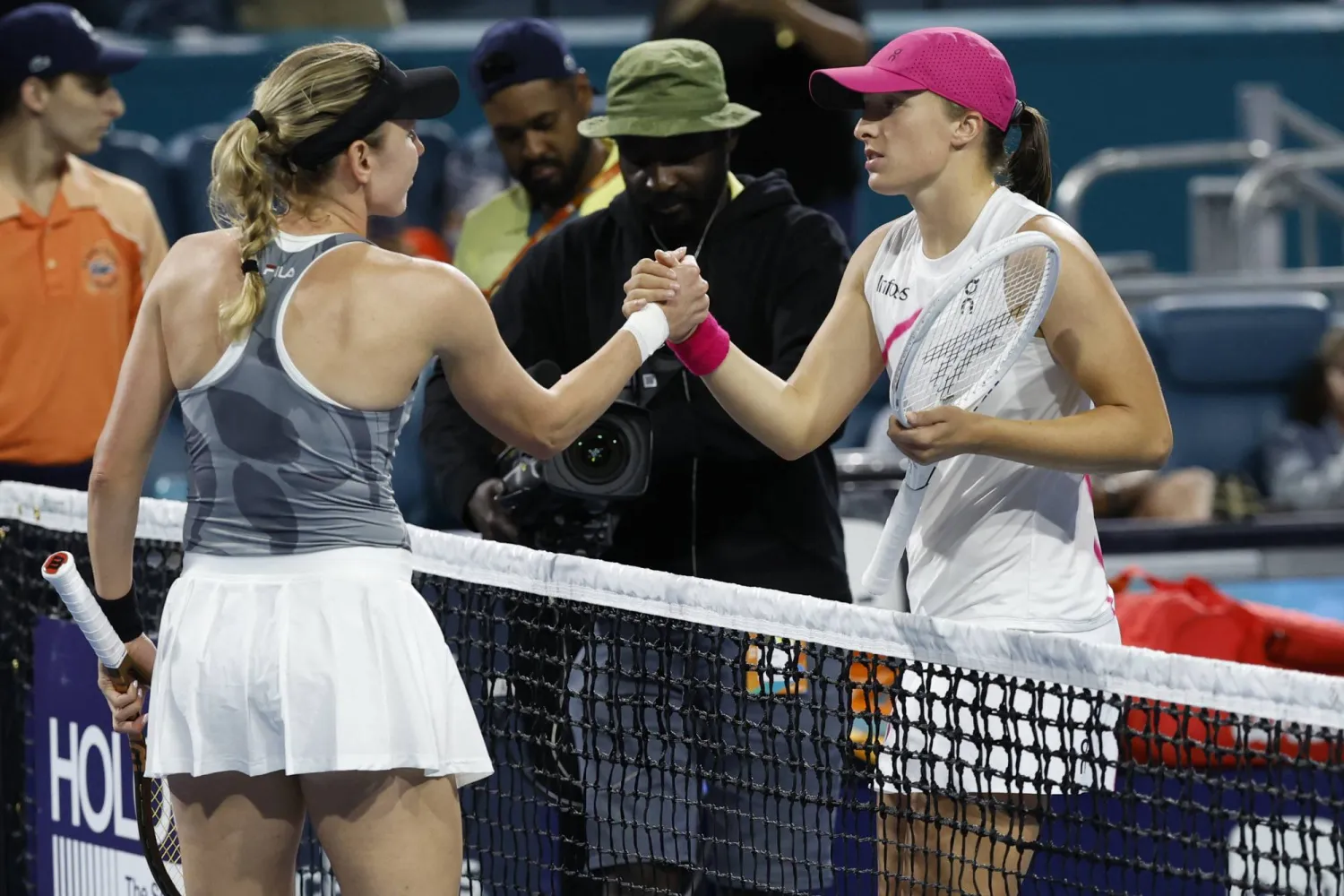 Mar 25, 2024; Miami Gardens, FL, USA; Ekaterina Alexandrova (L) shakes hands with Iga Swiatek (POL) (R) after their match on day eight of the Miami Open at Hard Rock Stadium. Credit: Geoff Burke-USA TODAY Sports