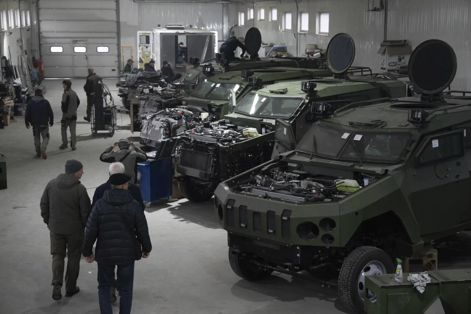 Armored vehicles are worked on at a factory in Ukraine, on Friday, December 22, 2023. (AP Photo/Evgeniy Maloletka)