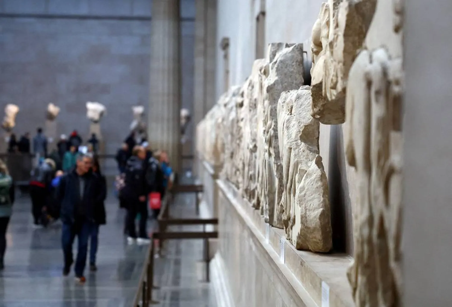 People view examples of the Parthenon sculptures, sometimes referred to in the UK as the Elgin Marbles, on display at the British Museum in London, Britain, November 29, 2023. (Reuters)