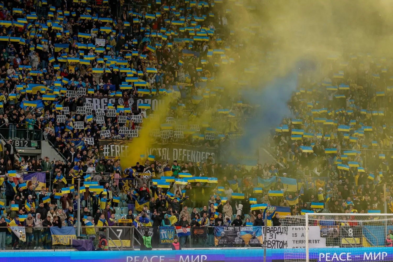 26 March 2024, Poland, Wroclaw: Ukraine fans cheer in the stands during the UEFA Euro 2024 Qualifying play-off final soccer match between Ukraine and Iceland at the Wroclaw Stadium. Photo: Krzysztof Zatycki/ZUMA Press Wire/dpa