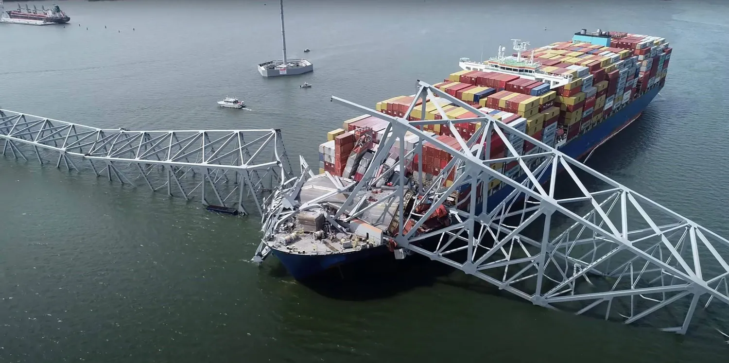 This handout screegrab courtesy of the National Transportation Safety Board taken on March 26, 2028, shows part of the steel frame of the Francis Scott Key Bridge sitting on top of the container ship Dali after the bridge collapsed in Baltimore, Maryland, on March 26, 2024. (Photo by National Transportation Safety Board / Youtube / AFP)