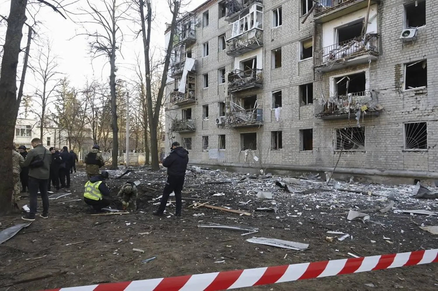 Police secure the site of shelling near residential buildings in Kharkiv, Ukraine, 27 March 2024, amid the Russian invasion. (EPA)