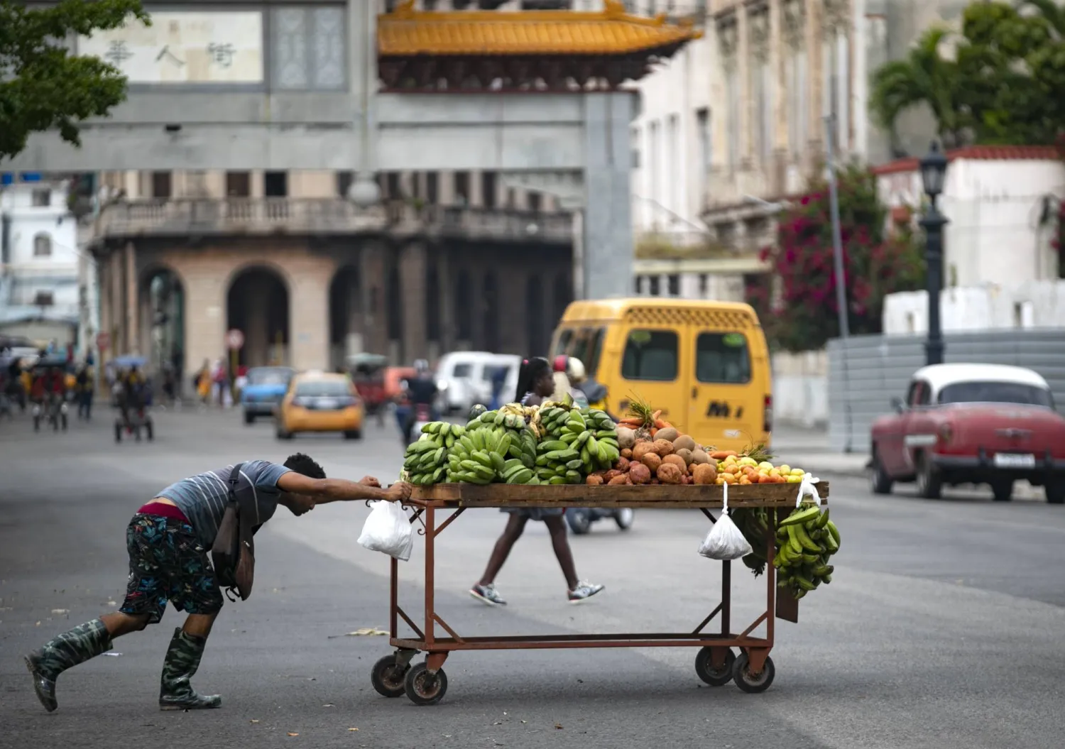 A vegetable seller pushes his cartwheel in a street in Havana, Cuba, 24 March 2024. EPA/Yander Zamora