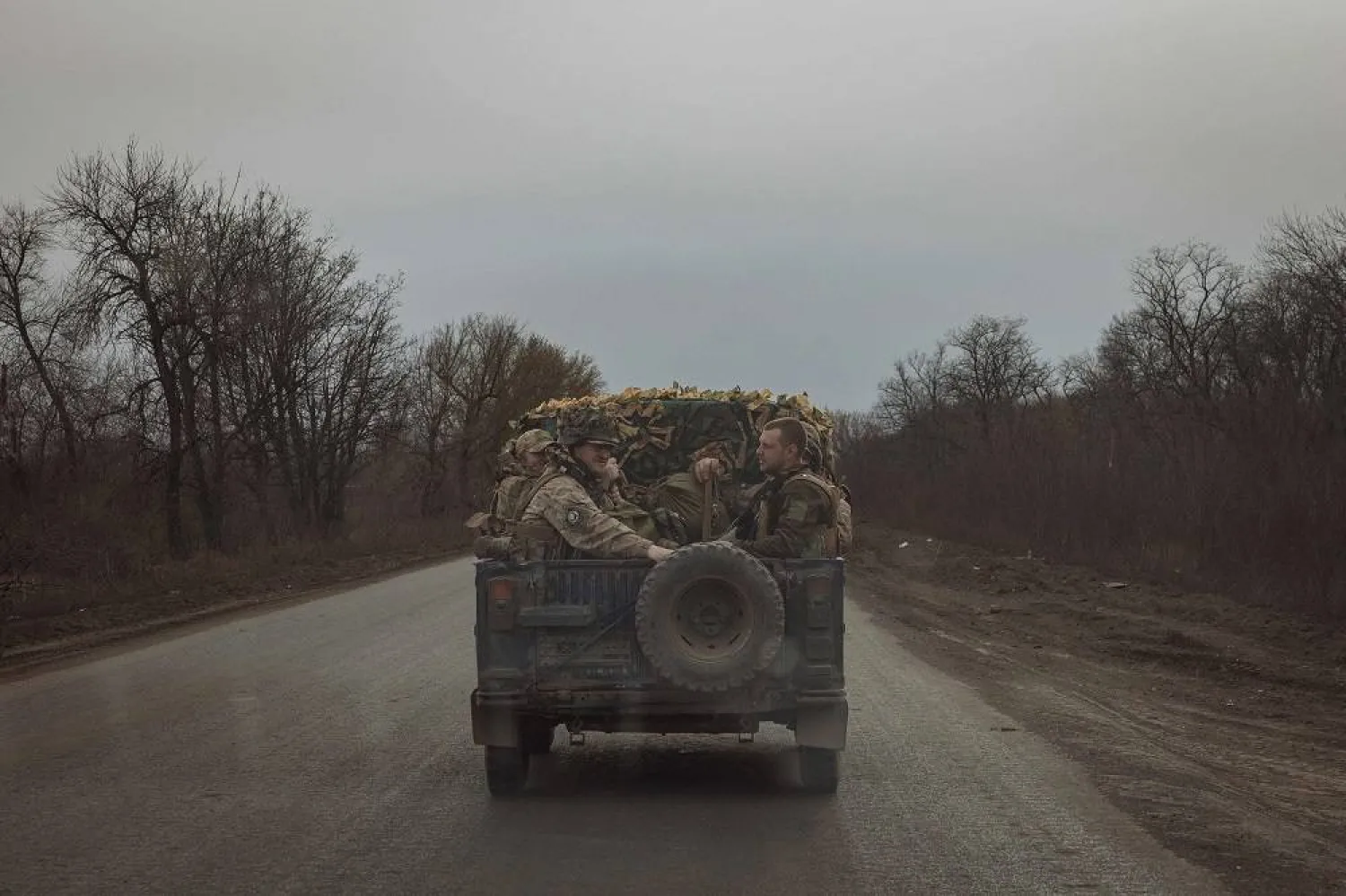 Ukrainian servicemen drive in a military vehicle on a road near the town of Chasiv Yar, Donetsk region, amid Russia's invasion on Ukraine. (AFP)
