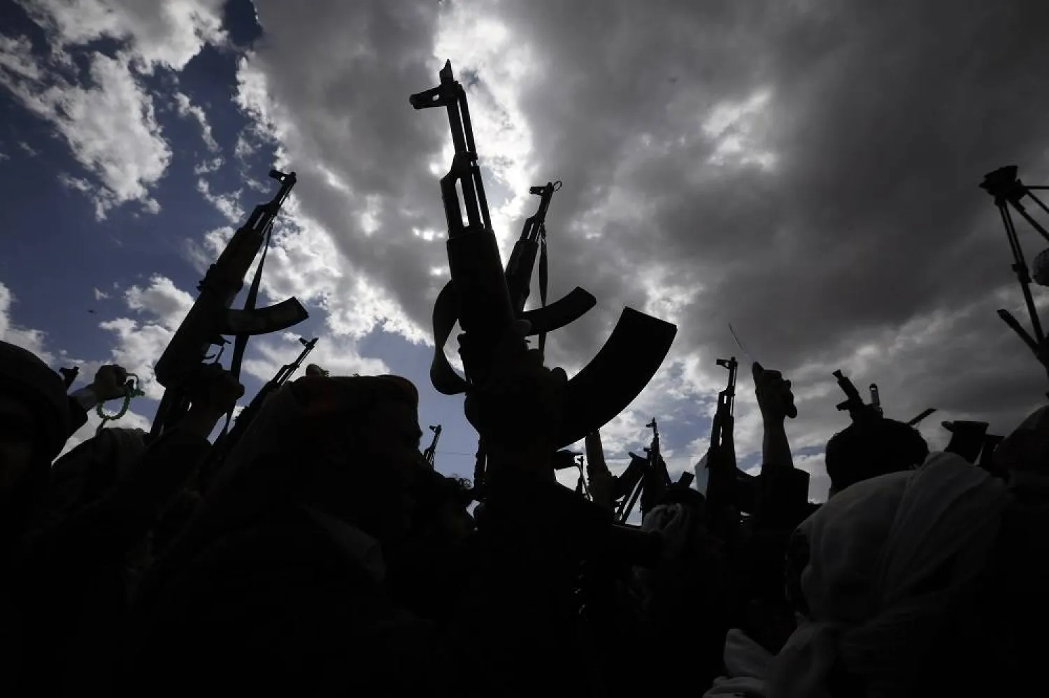 Houthi supporters hold up weapons during a protest against the US and Israel, and in solidarity with the Palestinians, in Sanaa, Yemen, 29 March 2024. (EPA)