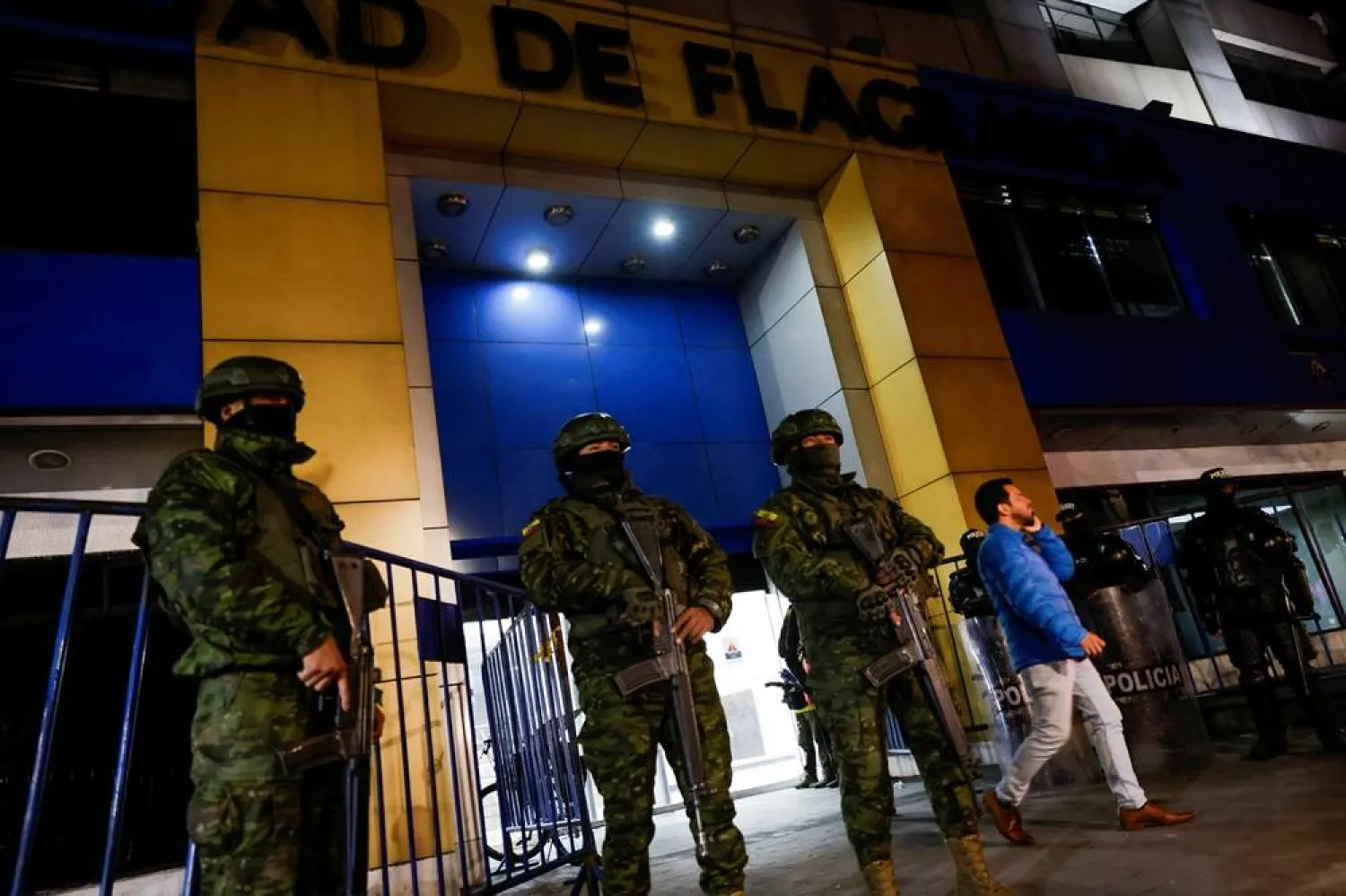  Police and military officials stand guard outside the Flagrancy Unit, where former Ecuador Vice President Jorge Glas is believed to be detained, in Quito, Ecuador April 6, 2024. (Reuters)
