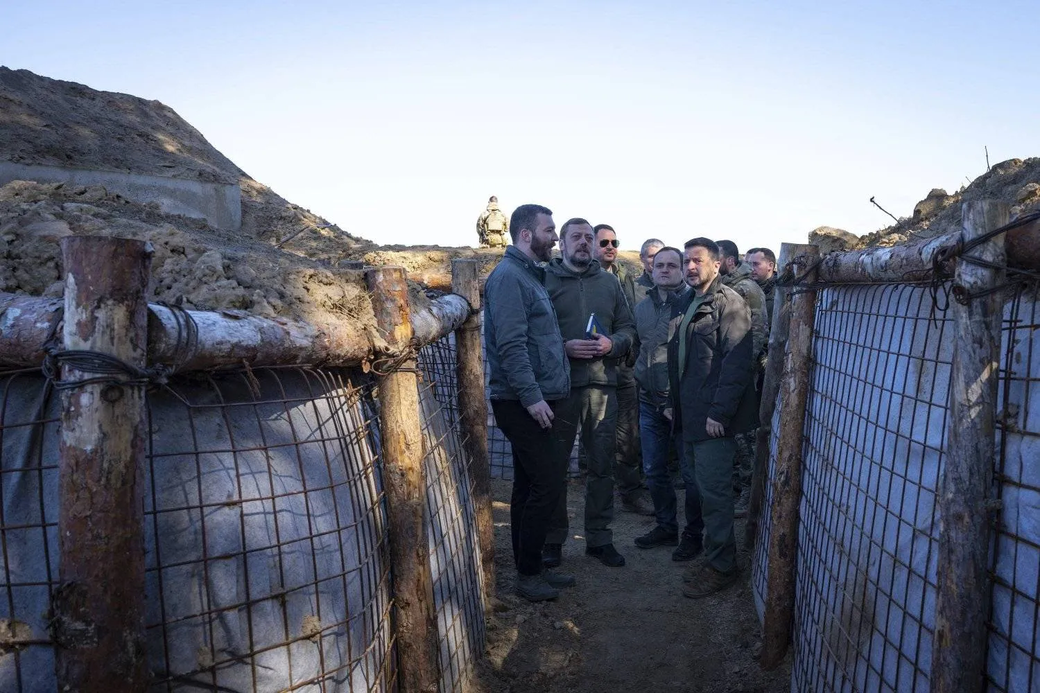 In this photo provided by the Ukrainian Presidential Press Office, Ukrainian President Volodymyr Zelensky, right, inspects the fortification lines in Chernihiv region, Ukraine, Friday, Apr. 5, 2024. (Ukrainian Presidential Press Office via AP)