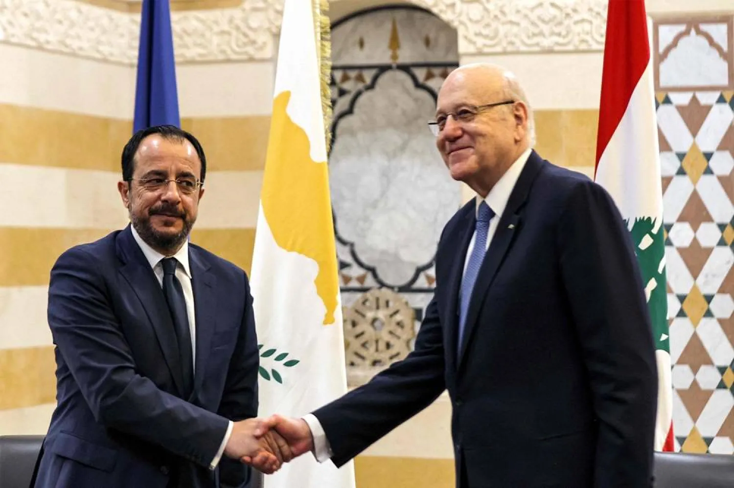 Lebanon's caretaker Prime Minister Najib Mikati (R) receives Cyprus' President Nikos Christodoulides at the government palace in central Beirut on April 8, 2024. (AFP)