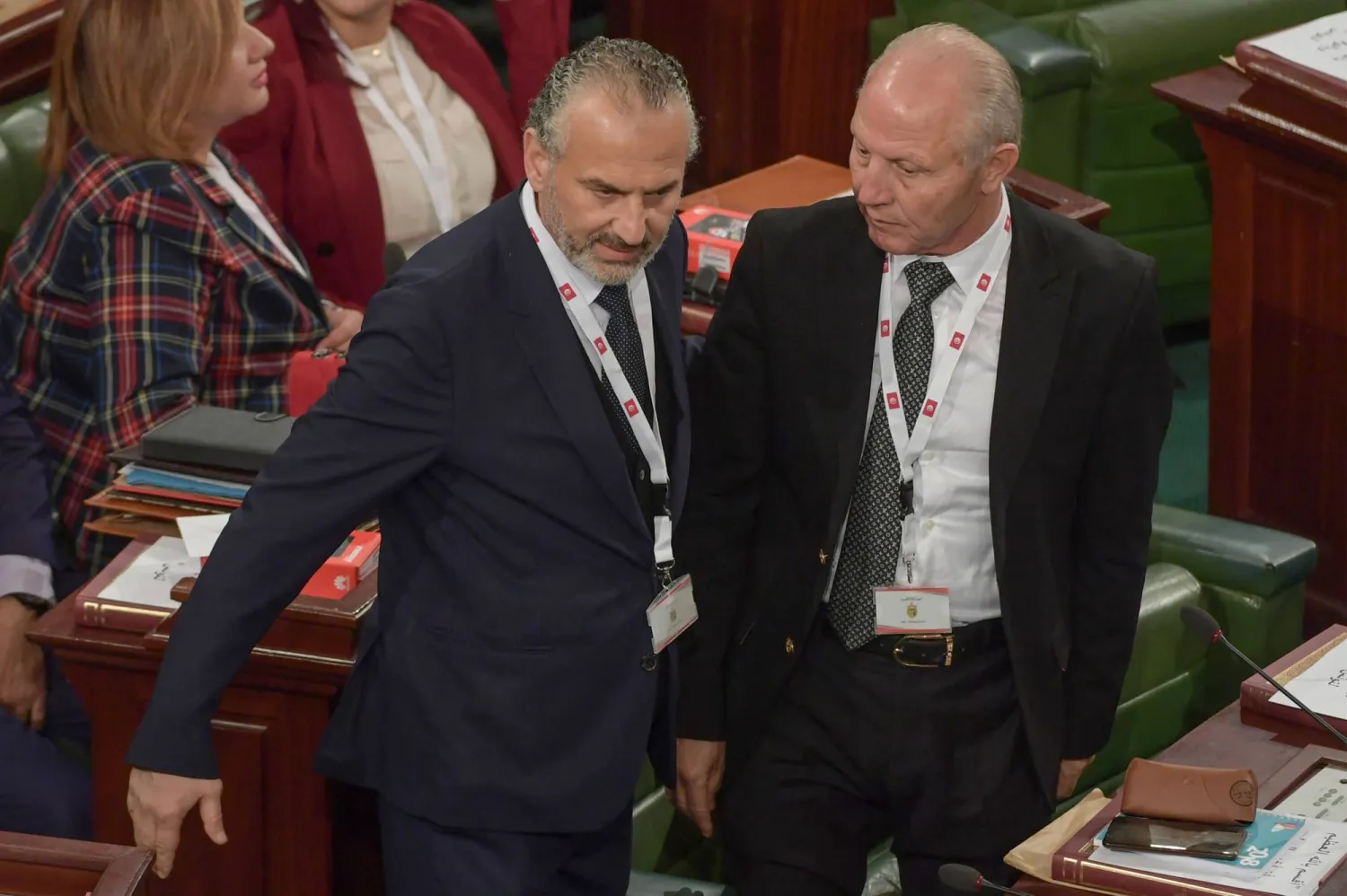 رضا شرف الدين (إلى اليمين) متهم بعدة تهم فساد (غيتي)