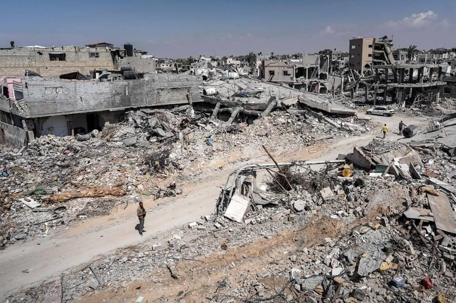 A man stands by the rubble of a destroyed building in Khan Younis on April 7, 2024 after Israel pulled its ground forces out of the southern Gaza Strip, six months into the devastating war sparked by the October 7 attacks. (AFP)