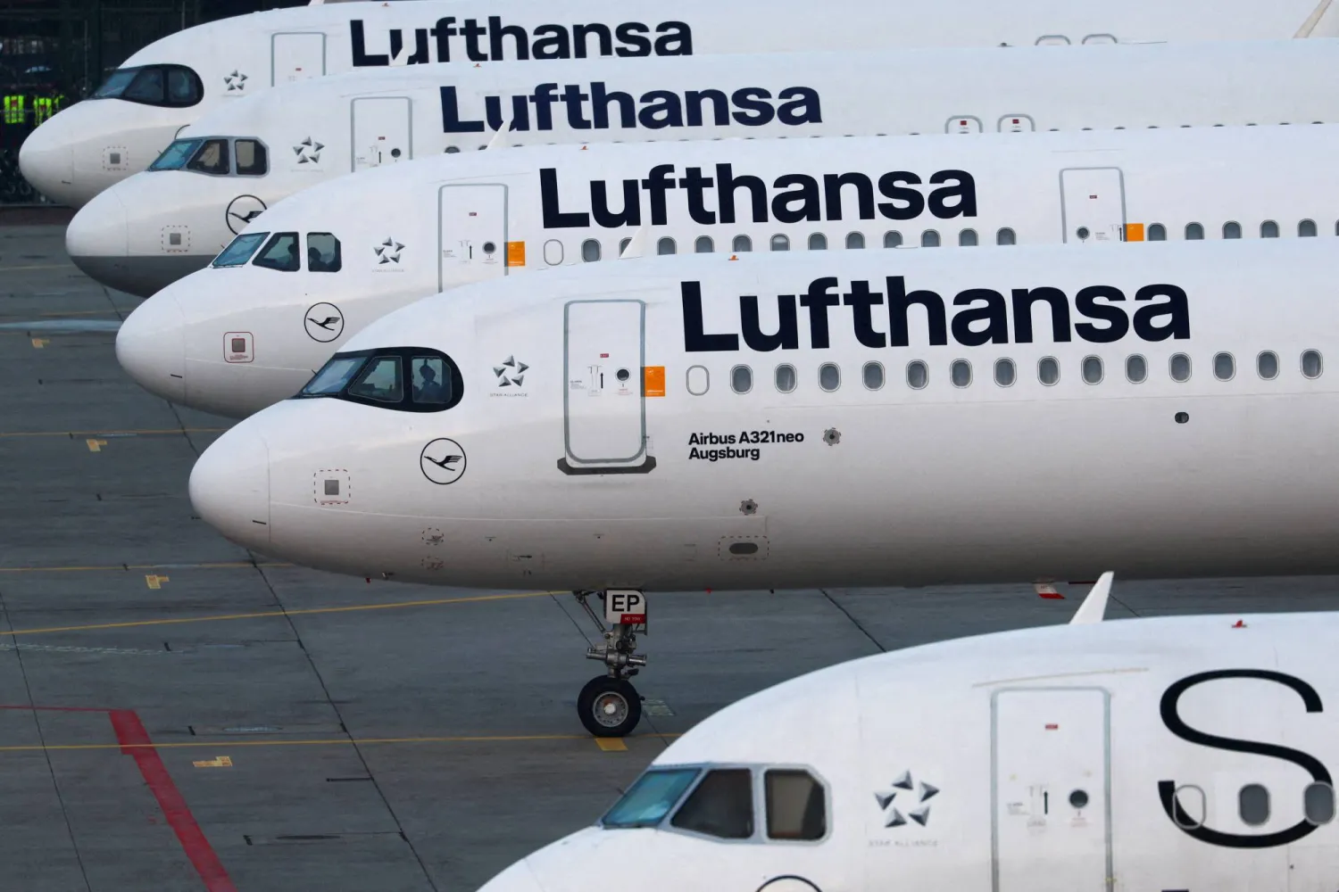 FILE PHOTO: Lufthansa planes stand parked in Frankfurt, Germany, March 7, 2024. REUTERS/ Kai Pfaffenbach/File Photo