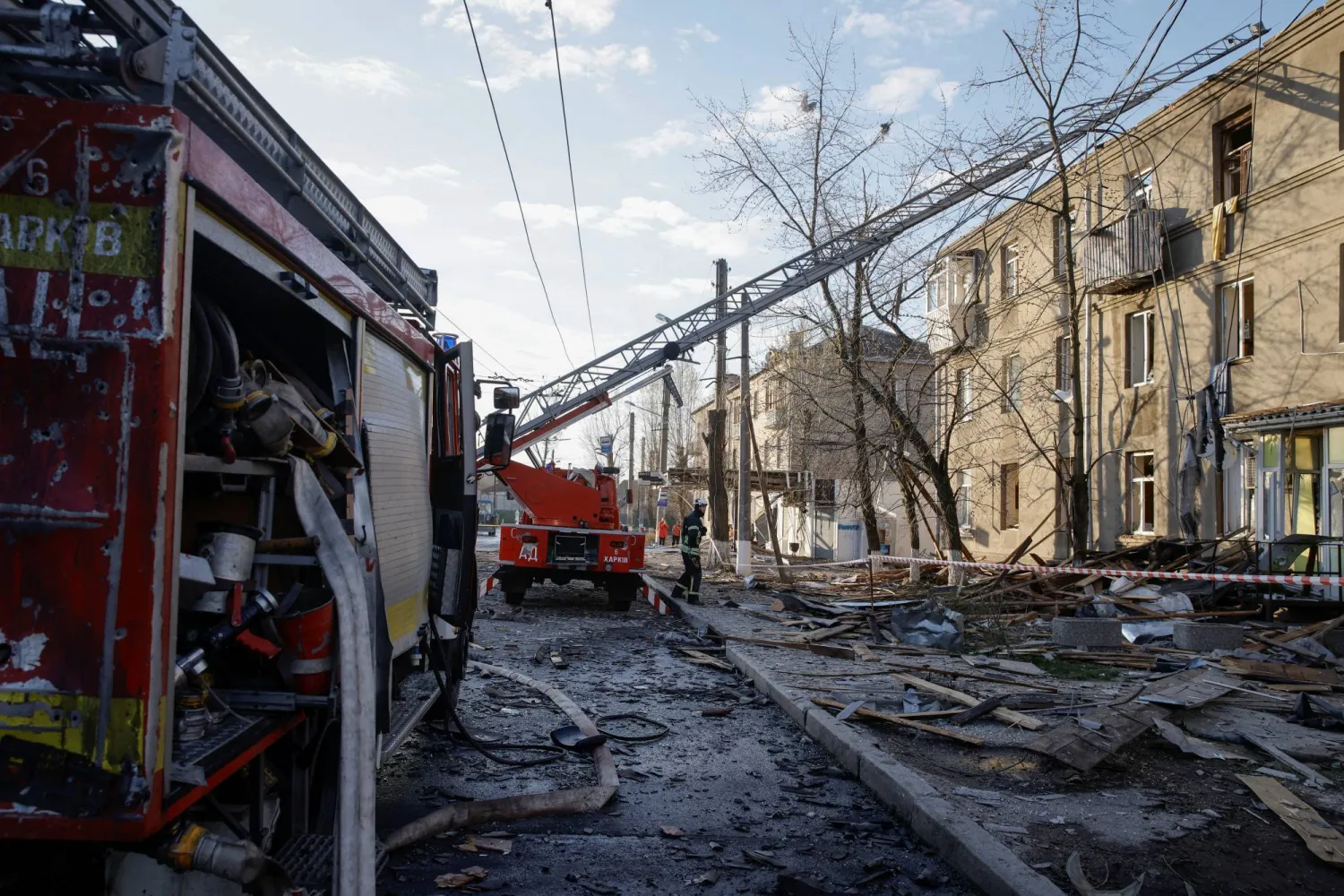 A rescuer works at a site of a Russian drone strike, amid Russia's attack on Ukraine, in Kharkiv, Ukraine April 4, 2024. REUTERS/Yevhen Titov