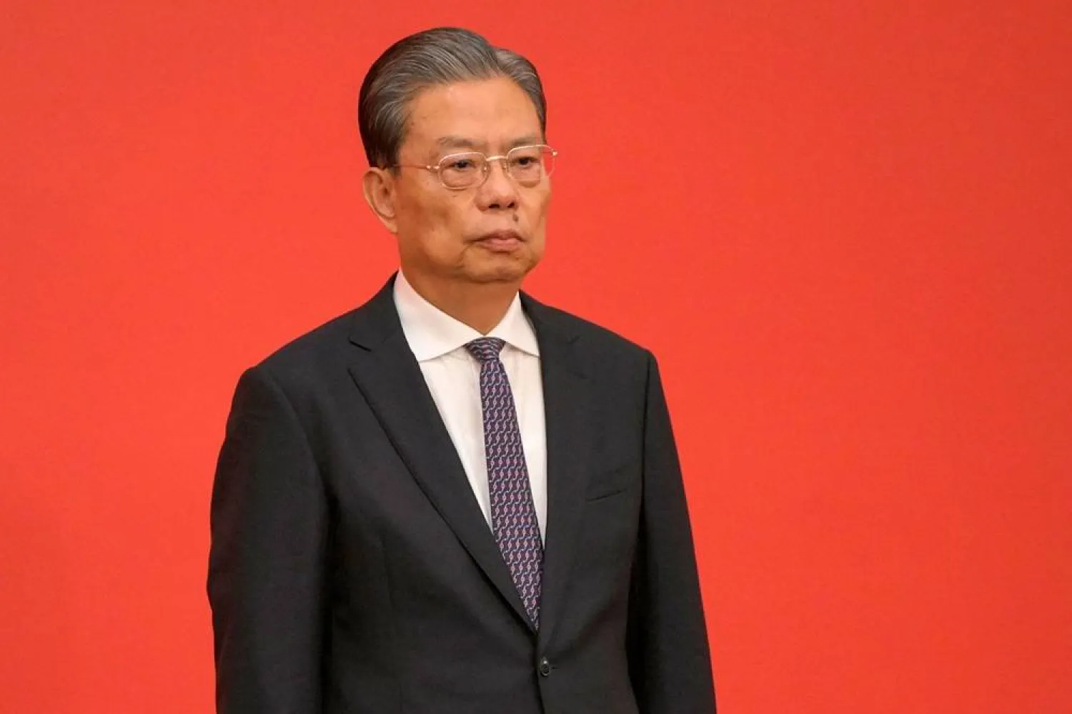 Zhao Leji, current Communist Party of China's Politburo Standing Committee member, applauds as he is introduced as a member of the Communist Party of China's Politburo Standing Committee, at the Great Hall of the People in Beijing on October 23, 2022. (AFP)