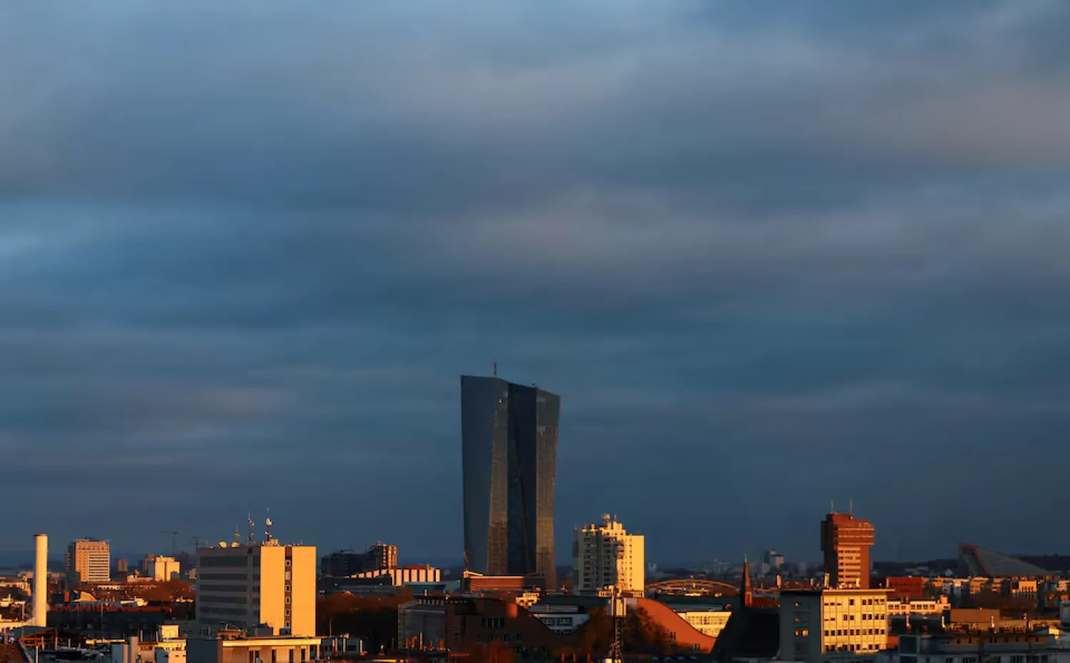 The building of the European Central Bank (ECB) appears on the horizon during sunset in Frankfurt, Germany, December 2, 2023. REUTERS