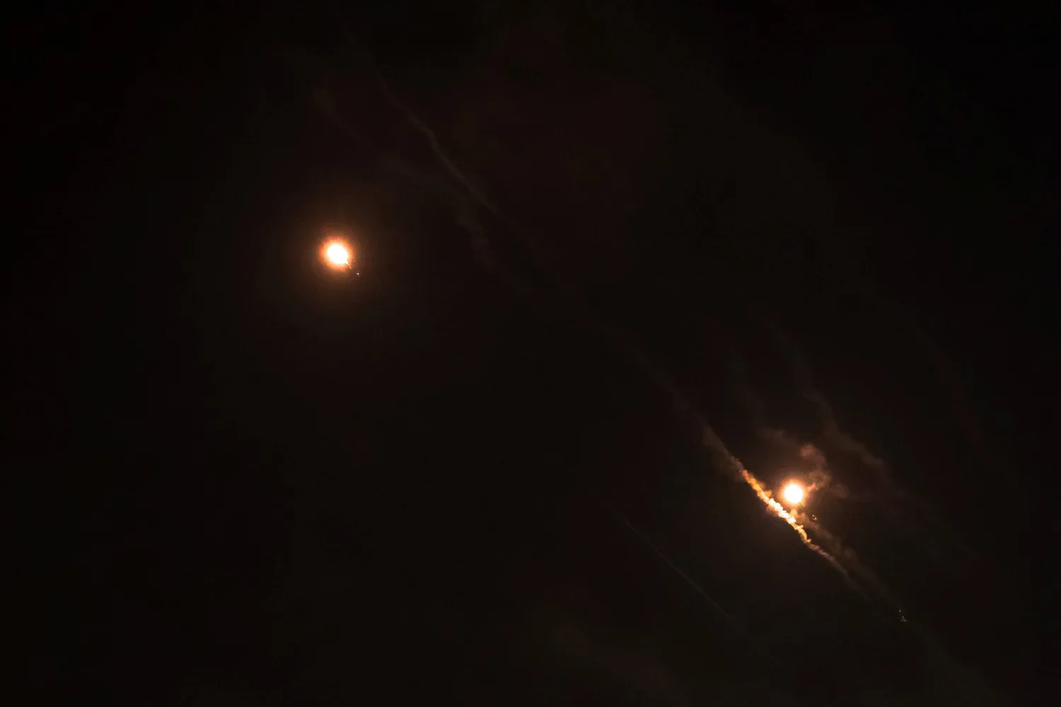 File photo: Objects are seen in the sky above Jerusalem after Iran launched drones and missiles towards Israel, in Jerusalem April 14, 2024. REUTERS/Ronen Zvulun