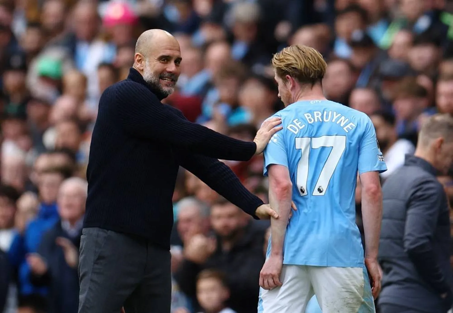 Soccer Football - Premier League - Manchester City v Luton Town - Etihad Stadium, Manchester, Britain - April 13, 2024 Manchester City's Kevin De Bruyne with manager Pep Guardiola after being substituted. (Reuters) 