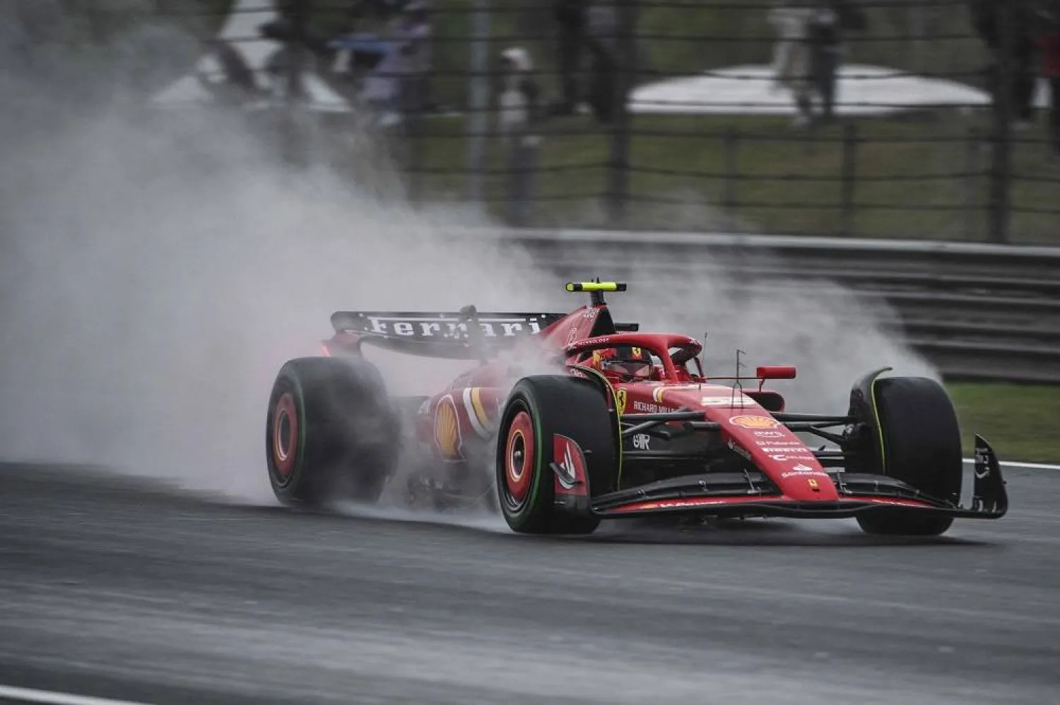 Ferrari's Spanish driver Carlos Sainz Jr drives during the sprint qualifying session ahead of the Formula One Chinese Grand Prix at the Shanghai International Circuit in Shanghai on April 19, 2024. (AFP)
