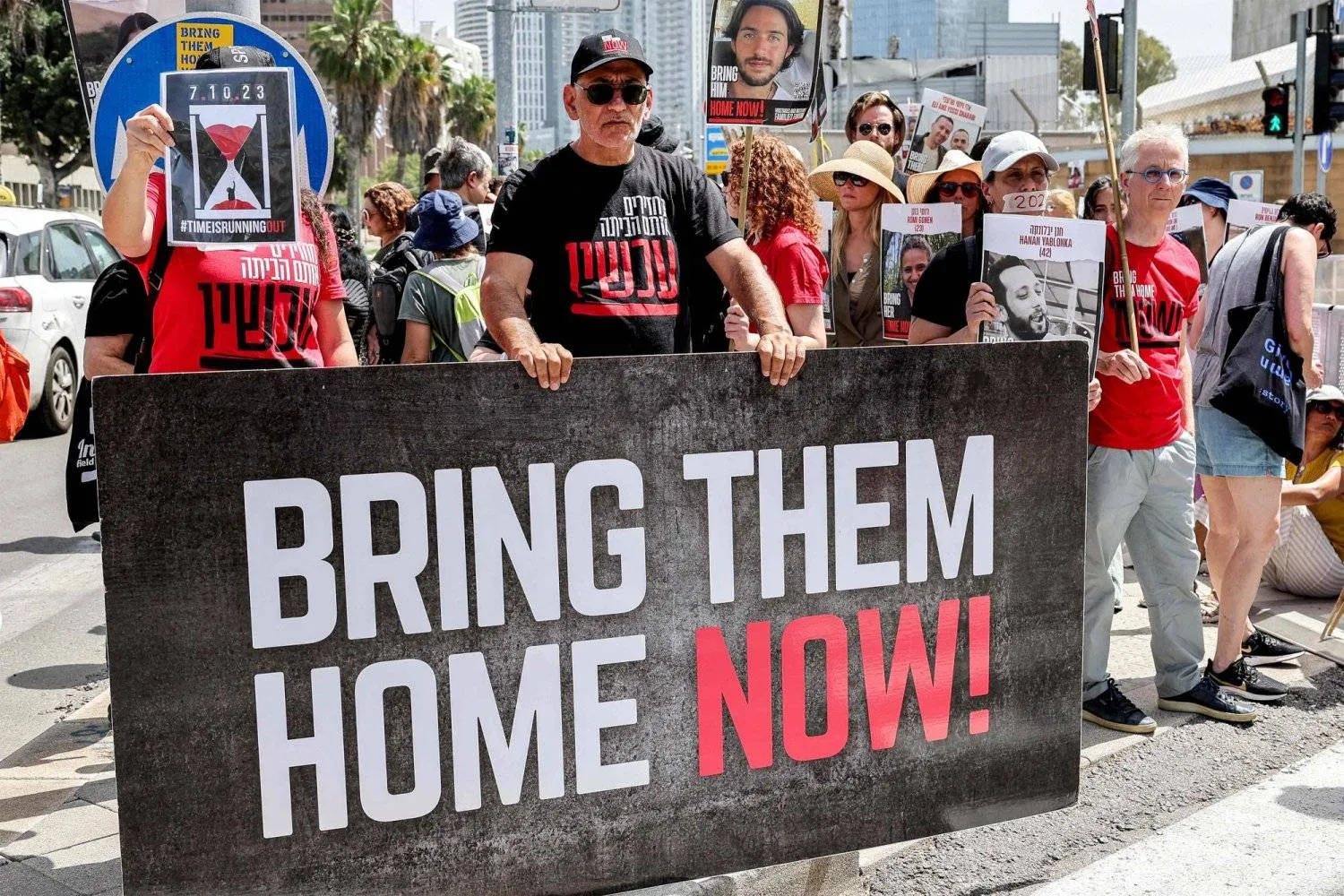 Relatives of Israeli hostages held in Gaza since October 7 protest outside the Defense Ministry headquarters in Tel Aviv on April 25, 2024. (Photo by JACK GUEZ / AFP)