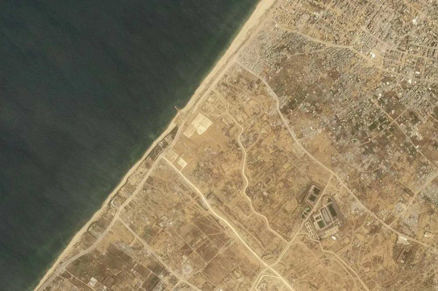 This satellite picture taken by Planet Labs PBC show the construction of a new aid port near Gaza City, Gaza Strip, on Wednesday, April 24, 2024. (Planet Labs PBC via AP)