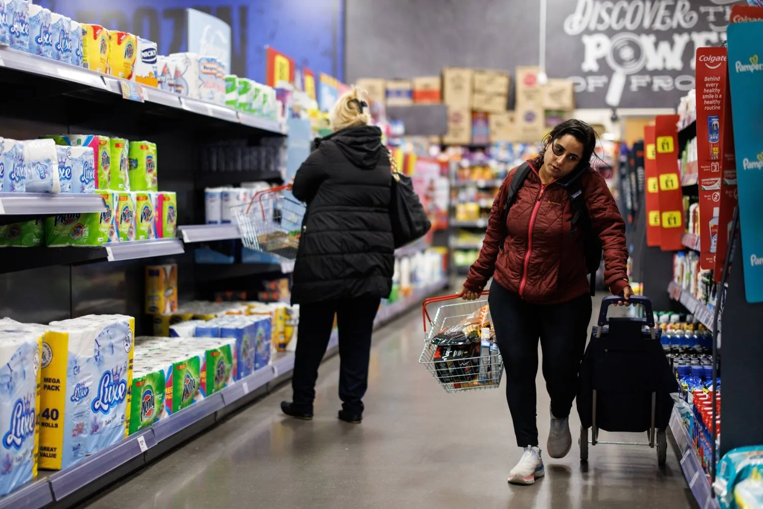 Consumers shopping in a supermarket in the British capital (EPA)