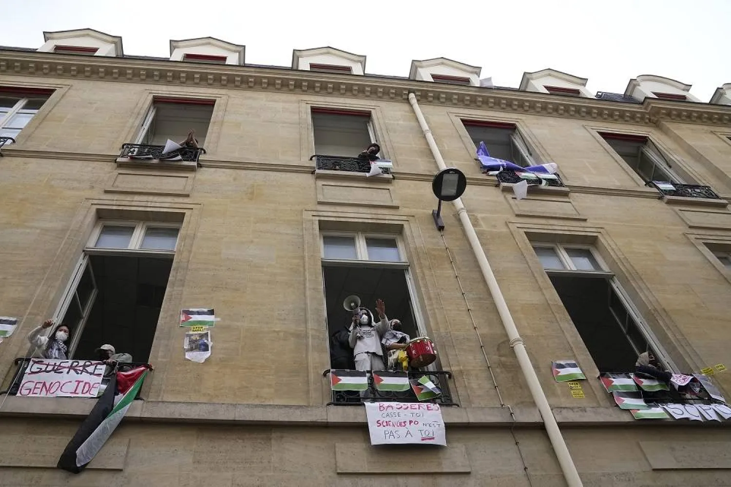Students protest a police evacuation outside Sciences Po university in Paris Friday, April 26, 2024. (AP)